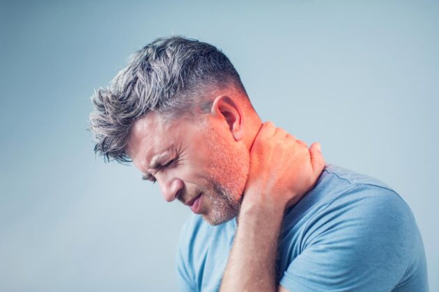 man suffering from neck pain.